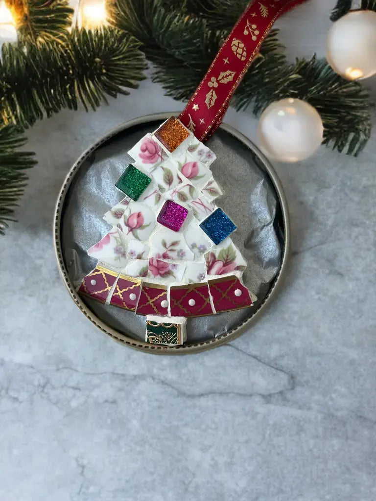 Handmade upcycled ceramic mosaic Christmas tree ornament in floral pink pattern inside gift decorated tin box