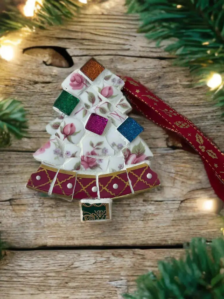 Handmade mosaic Christmas tree ornament made from broken floral ceramics and red gold patterned china